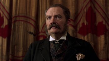 Movie still from “Topsy-Turvy” (1999), directed by Mike Leigh – An old man with a mustache and a beard; Close Up shot, Low angle