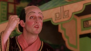 Movie still from “Topsy-Turvy” (1999), directed by Mike Leigh – A wax statue of a man with a bald head; Close Up shot, Low angle