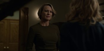 Movie still from “House of Cards” (2013), created by Beau Willimon – A woman standing next to another woman in front of a mirror; Close Up shot, Over the shoulder angle