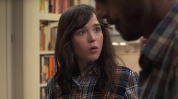 Movie still from “Touchy Feely” (2013), directed by Lynn Shelton – A woman in a plaid shirt looking at a man in a plaid shirt; Close Up shot, Over the shoulder angle