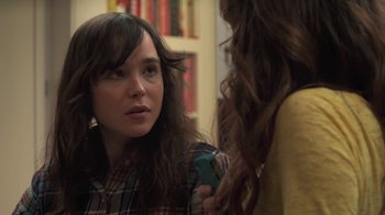 Movie still from “Touchy Feely” (2013), directed by Lynn Shelton – A woman looking at her cell phone in front of a mirror; Close Up shot, Over the shoulder angle