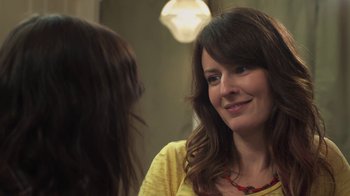 Movie still from “Touchy Feely” (2013), directed by Lynn Shelton – A woman is talking to another woman in a room; Close Up shot, Over the shoulder angle