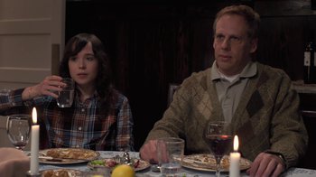 Movie still from “Touchy Feely” (2013), directed by Lynn Shelton – A man and a woman sitting at a dinner table; Medium shot, Over the shoulder angle