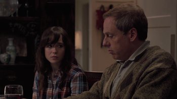 Movie still from “Touchy Feely” (2013), directed by Lynn Shelton – A man and a woman sitting at a table in a room; Close Up shot, Over the shoulder angle