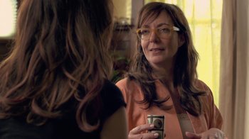 Movie still from “Touchy Feely” (2013), directed by Lynn Shelton – A woman holding a camera in front of a mirror; Close Up shot, Over the shoulder angle