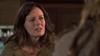 Movie still from “Touchy Feely” (2013), directed by Lynn Shelton – A person looking at the camera; Close Up shot, Over the shoulder angle