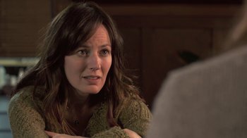 Movie still from “Touchy Feely” (2013), directed by Lynn Shelton – A person sitting on a couch; Close Up shot, Over the shoulder angle