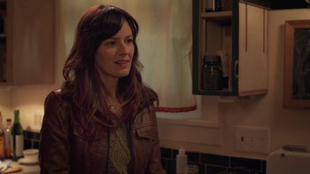 Movie still from “Touchy Feely” (2013), directed by Lynn Shelton – A woman standing in a kitchen next to a counter; Close Up shot, Over the shoulder angle