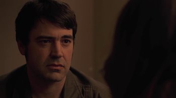 Movie still from “Touchy Feely” (2013), directed by Lynn Shelton – A person looking at the camera; Close Up shot, Over the shoulder angle