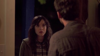 Movie still from “Touchy Feely” (2013), directed by Lynn Shelton – A woman looking at a man in the mirror; Medium shot, Over the shoulder angle