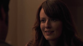 Movie still from “Touchy Feely” (2013), directed by Lynn Shelton – A person with long brown hair; Close Up shot, Over the shoulder angle