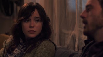 Movie still from “Touchy Feely” (2013), directed by Lynn Shelton – A woman sitting on top of a couch in front of a window; Close Up shot, Over the shoulder angle