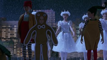 Movie still from “Toys” (1992), directed by Barry Levinson – A group of children dressed in costumes in the rain; Medium shot, High angle