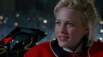 Movie still from “Toys” (1992), directed by Barry Levinson – A person with blonde hair and blue eyes; Close Up shot, Over the shoulder angle