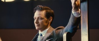 Movie still from “Trance” (2013), directed by Danny Boyle – A wax statue of a man in a suit and tie; Medium shot, Low angle