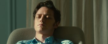 Movie still from “Trance” (2013), directed by Danny Boyle – A person sleeping on a couch; Close Up shot, High angle