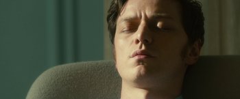 Movie still from “Trance” (2013), directed by Danny Boyle – A person with his eyes closed; Close Up shot, Low angle