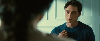 Movie still from “Trance” (2013), directed by Danny Boyle – A man looking at himself in the mirror; Close Up shot, Over the shoulder angle