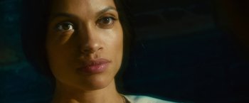 Movie still from “Trance” (2013), directed by Danny Boyle – A woman's face in a dark room; Close Up shot, Over the shoulder angle