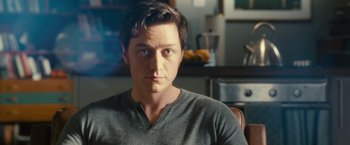 Movie still from “Trance” (2013), directed by Danny Boyle – A person sitting in a chair; Close Up shot, Over the shoulder angle