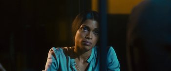 Movie still from “Trance” (2013), directed by Danny Boyle – A woman sitting in front of a window looking at the camera; Close Up shot, High angle