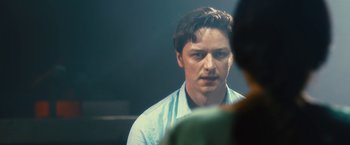 Movie still from “Trance” (2013), directed by Danny Boyle – A person looking at a mirror; Close Up shot, Over the shoulder angle