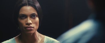 Movie still from “Trance” (2013), directed by Danny Boyle – A person wearing a white shirt; Close Up shot, Over the shoulder angle