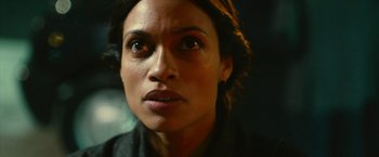 Movie still from “Trance” (2013), directed by Danny Boyle – A woman's face in a dark room; Close Up shot, Over the shoulder angle