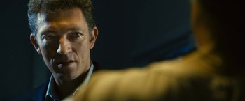 Movie still from “Trance” (2013), directed by Danny Boyle – A man's face in front of a mirror; Close Up shot, Over the shoulder angle