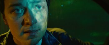 Movie still from “Trance” (2013), directed by Danny Boyle – A man's face in the dark; Extreme Close Up shot, Low angle