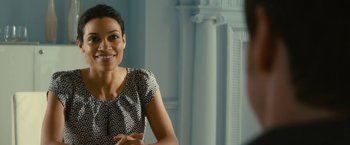 Movie still from “Trance” (2013), directed by Danny Boyle – A woman sitting in front of a man in front of a mirror; Close Up shot, Over the shoulder angle