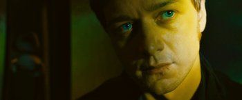 Movie still from “Trance” (2013), directed by Danny Boyle – A person with blue eyes; Close Up shot, Low angle