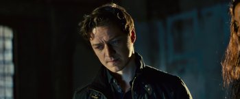 Movie still from “Trance” (2013), directed by Danny Boyle – A person wearing a jacket; Close Up shot, Low angle