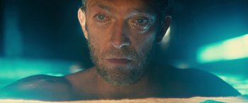 Movie still from “Trance” (2013), directed by Danny Boyle – A man's face in a mirror; Close Up shot, Low angle