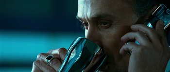 Movie still from “Transporter 3” (2008), directed by Olivier Megaton – A person drinking from a cup; Extreme Close Up shot, Low angle
