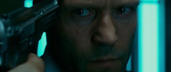 Movie still from “Transporter 3” (2008), directed by Olivier Megaton – A man's face with a cell phone; Extreme Close Up shot, Overhead angle