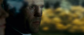 Movie still from “Transporter 3” (2008), directed by Olivier Megaton – A man's face with tears coming from his eyes; Close Up shot, Low angle