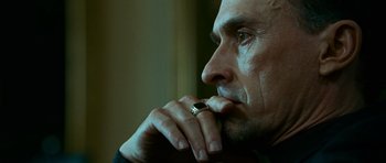 Movie still from “Transporter 3” (2008), directed by Olivier Megaton – A person with a ring on his finger; Close Up shot, Low angle