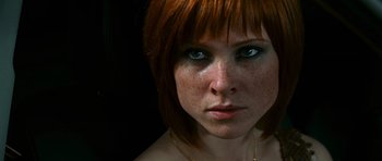 Movie still from “Transporter 3” (2008), directed by Olivier Megaton – A person with red hair and blue eyes; Close Up shot, Low angle
