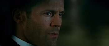 Movie still from “Transporter 3” (2008), directed by Olivier Megaton – A man's face in a dark room; Close Up shot, Low angle