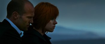 Movie still from “Transporter 3” (2008), directed by Olivier Megaton – A person with red hair; Close Up shot, Low angle