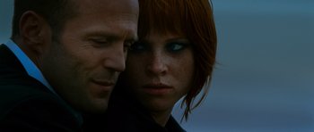 Movie still from “Transporter 3” (2008), directed by Olivier Megaton – A man and a woman face to face; Close Up shot, Low angle
