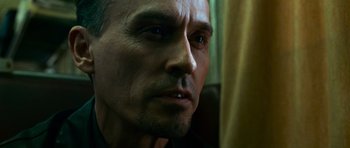 Movie still from “Transporter 3” (2008), directed by Olivier Megaton – A man's face looking into the distance; Close Up shot, Low angle