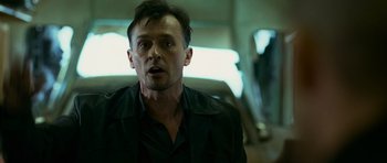 Movie still from “Transporter 3” (2008), directed by Olivier Megaton – A person wearing a black jacket; Close Up shot, Low angle