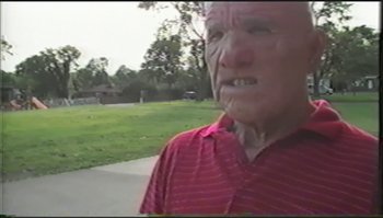 Movie still from “Trash Humpers” (2009), directed by Harmony Korine – An older man is standing in the grass; Close Up shot, Low angle