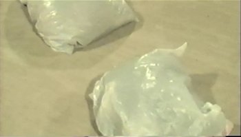 Movie still from “Trash Humpers” (2009), directed by Harmony Korine – View of some food wrapped in wax paper; Extreme Close Up shot, Overhead angle