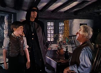 Movie still from “Treasure Island” (1950), directed by Byron Haskin – A group of people standing in a living room; Medium shot, Over the shoulder angle