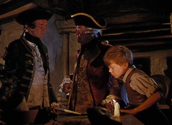 Movie still from “Treasure Island” (1950), directed by Byron Haskin – A group of people standing next to each other in a room; Medium shot, High angle