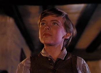 Movie still from “Treasure Island” (1950), directed by Byron Haskin – A young boy looking up into the sky; Close Up shot, Low angle