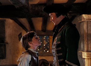 Movie still from “Treasure Island” (1950), directed by Byron Haskin – A man and a boy in medieval garb looking at each other; Medium shot, Over the shoulder angle